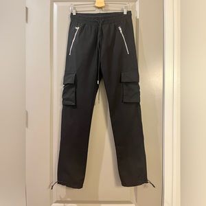 Christos Black Cargo zipper pocket shorts with cable wire drawstrings.